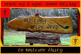 Hobbits sharing pipes around a table