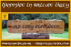 Hobbits gathered around a fire, pipes in hand