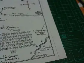 Thorin Oakenshield examining Thror's map with an eye symbol